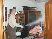 Allstate Animal Control technician applying skunk spray odor control treatment